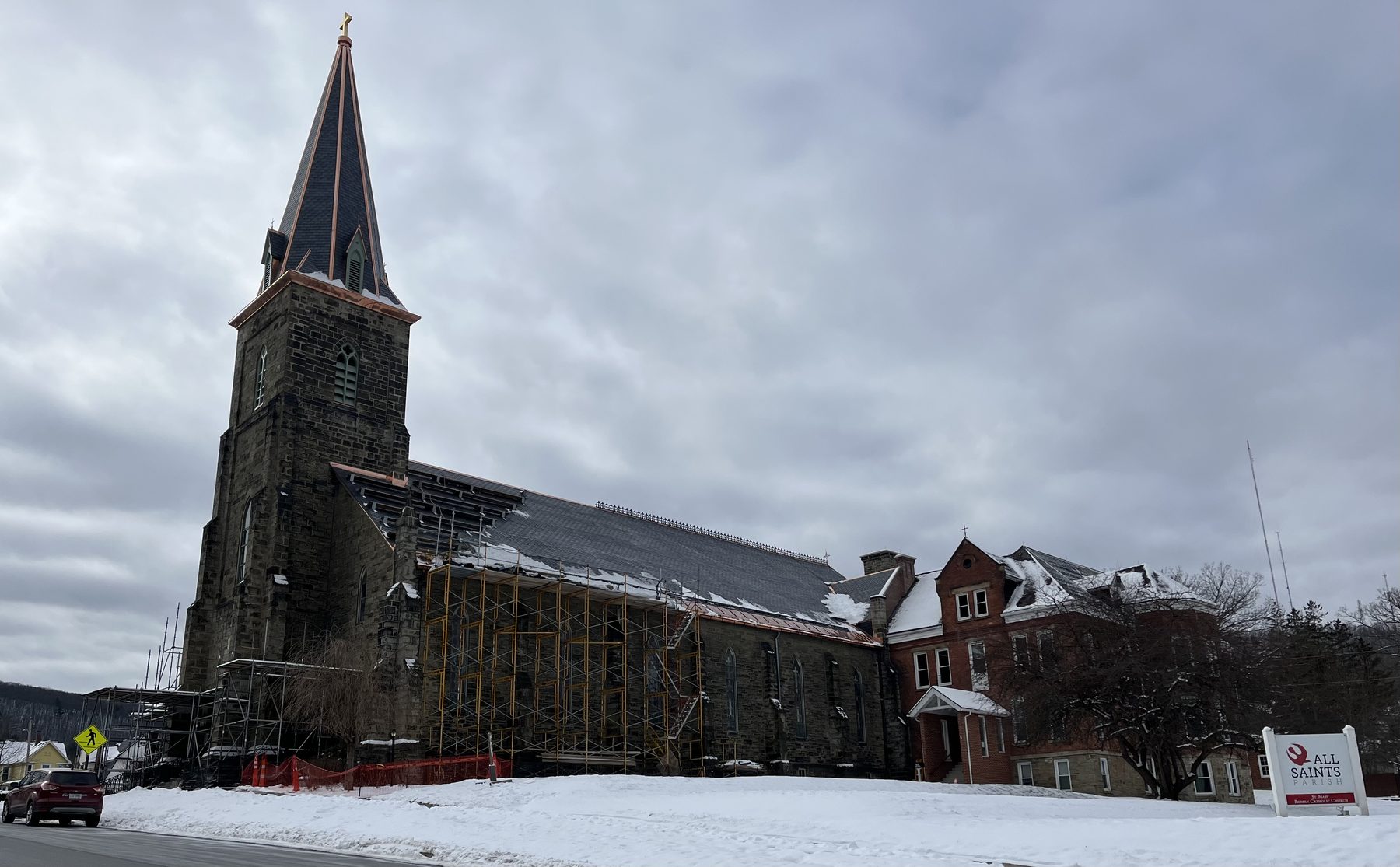 St. Mary Church from State Street with scaffolding along the nave and new copper trim on the steeple