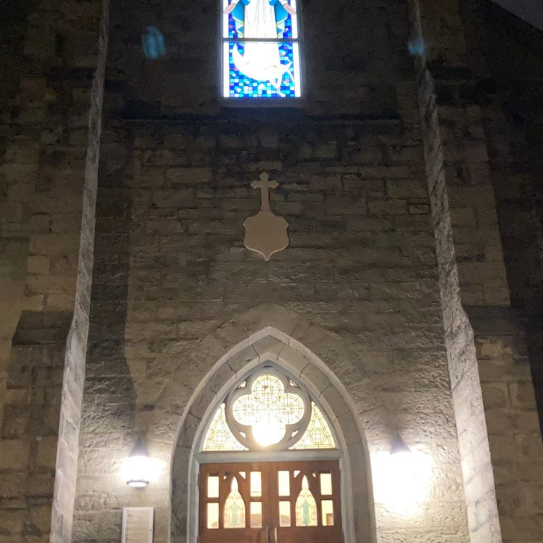 The Gothic entrance doors and stained glass