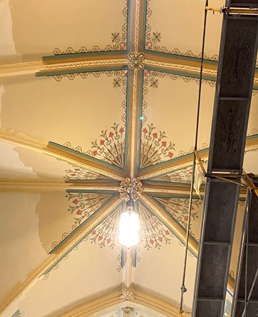 Newly painted vaulted ceiling with stenciling