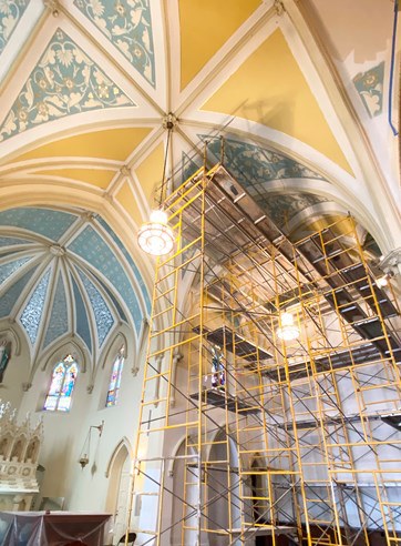 Scaffolding beneath the painted ceiling
