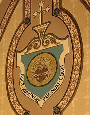 Hand-painted emblem with the words Adveniat Regnum Tuum